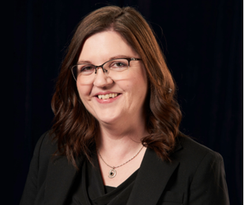 A person in a black suit

AI-generated content may be incorrect.